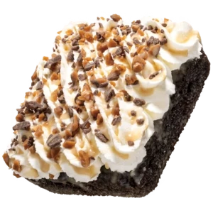 Crumbl Chocolate Toffee Tres Leches Cake with whipped cream and toffee bits